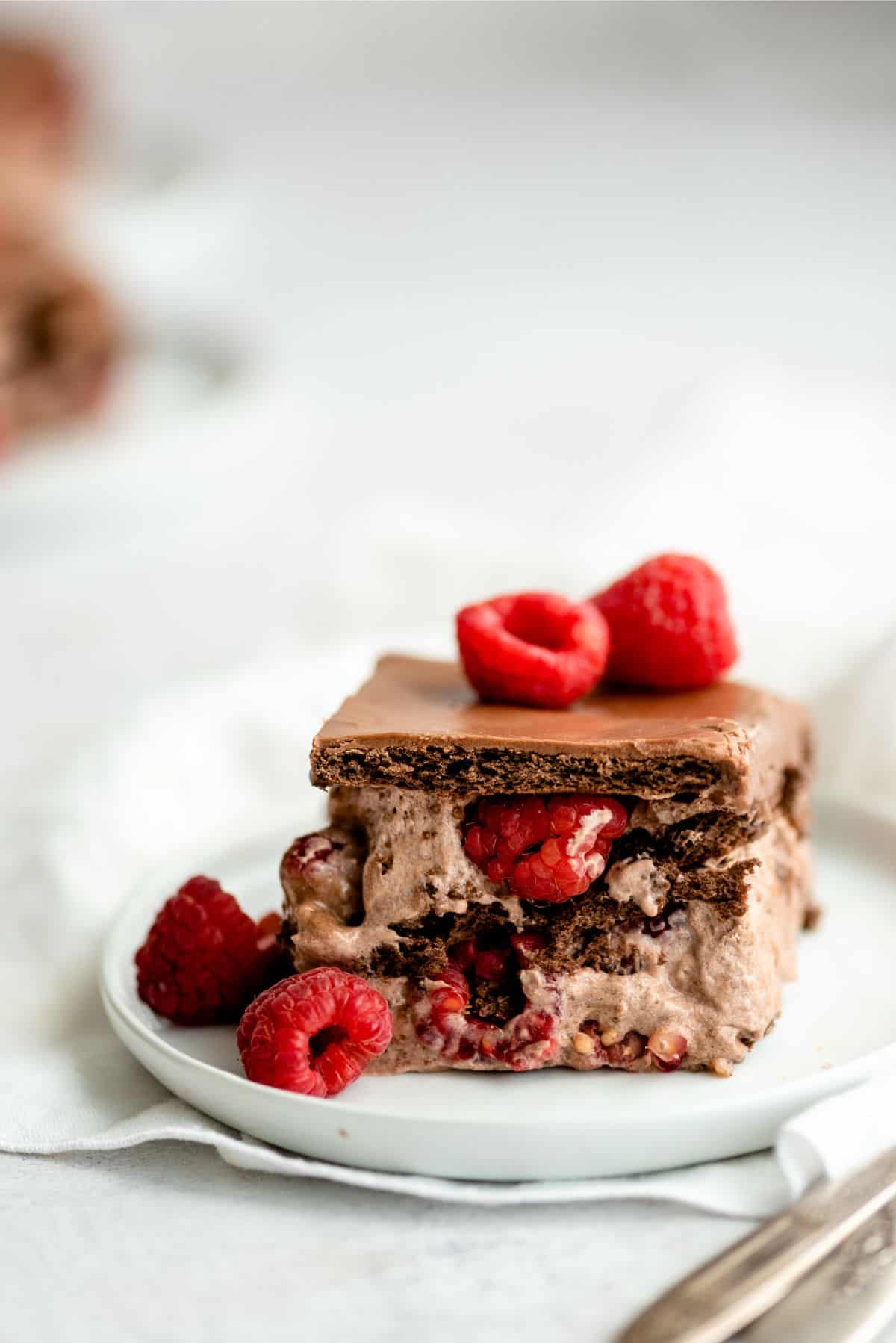 1 slice of No Bake Chocolate Raspberry Eclair Cake on a small plate