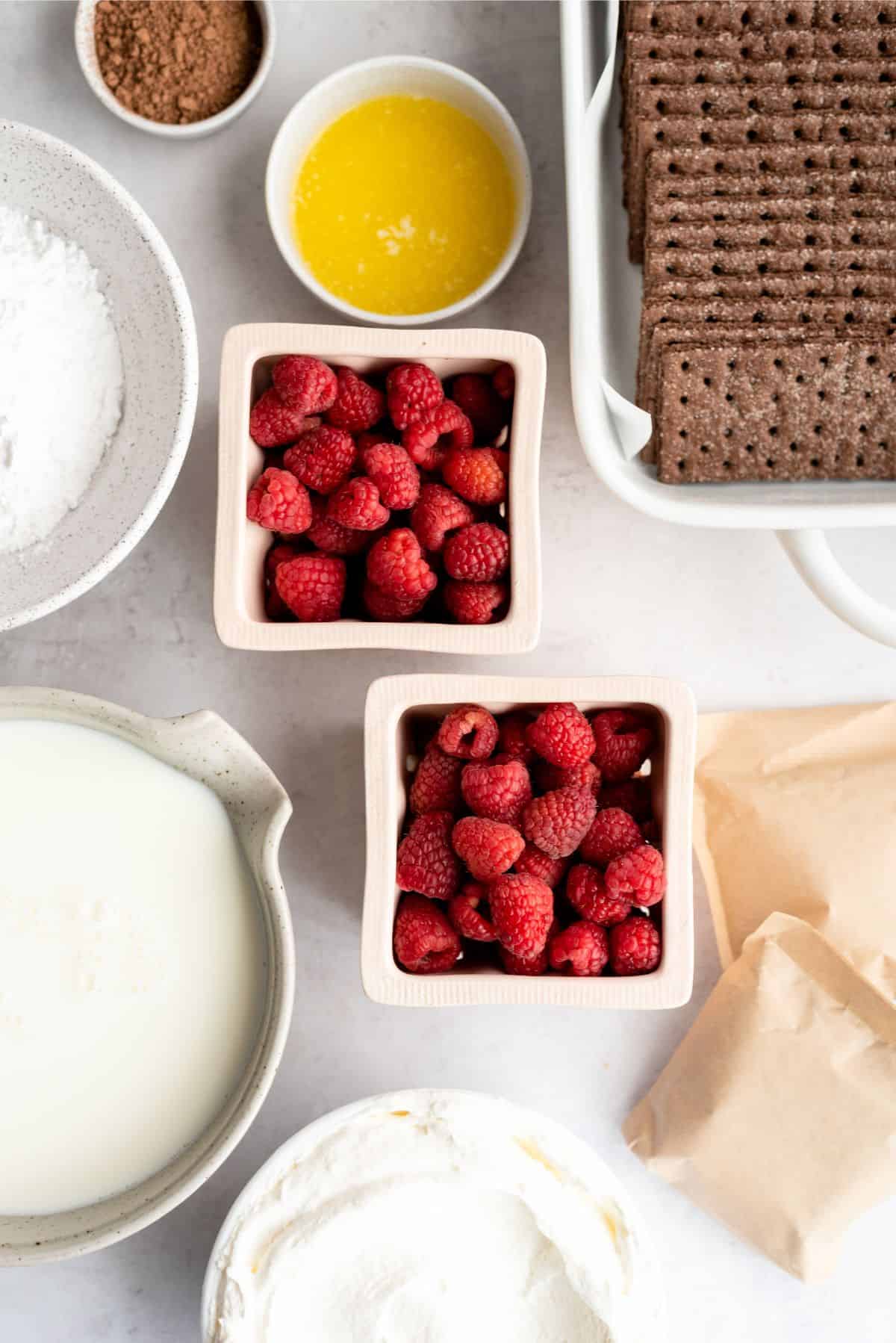 Ingredients needed to make Chocolate Raspberry Eclair Cake.