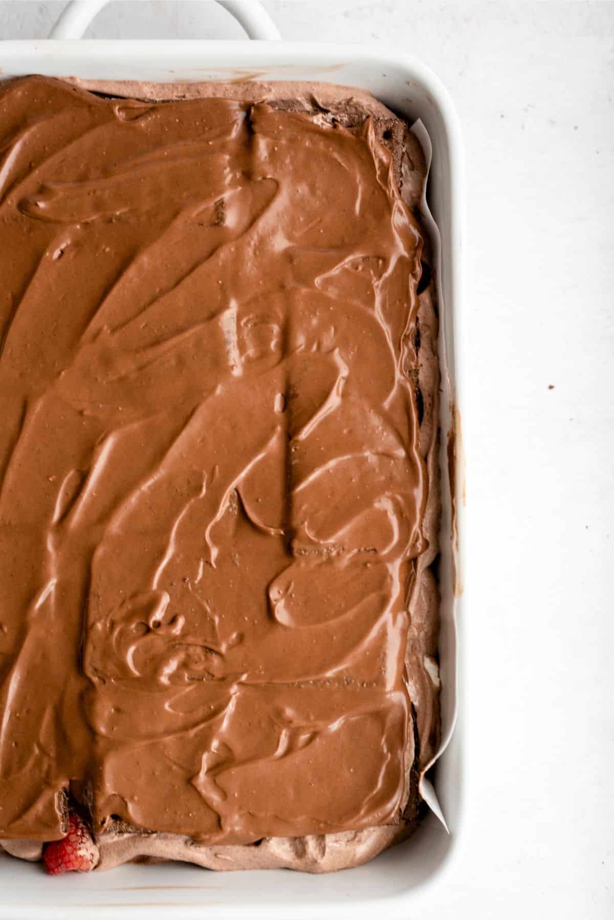 Frosting spread on top of graham cracker layer.