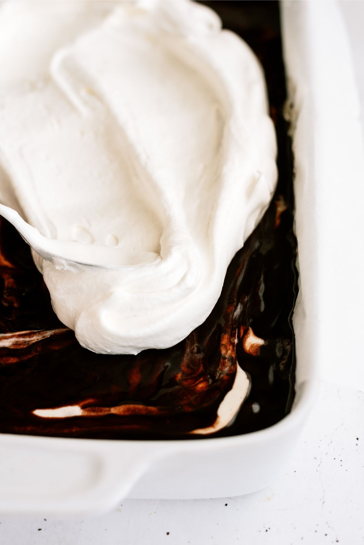 Add whip cream layer on top of hot fudge