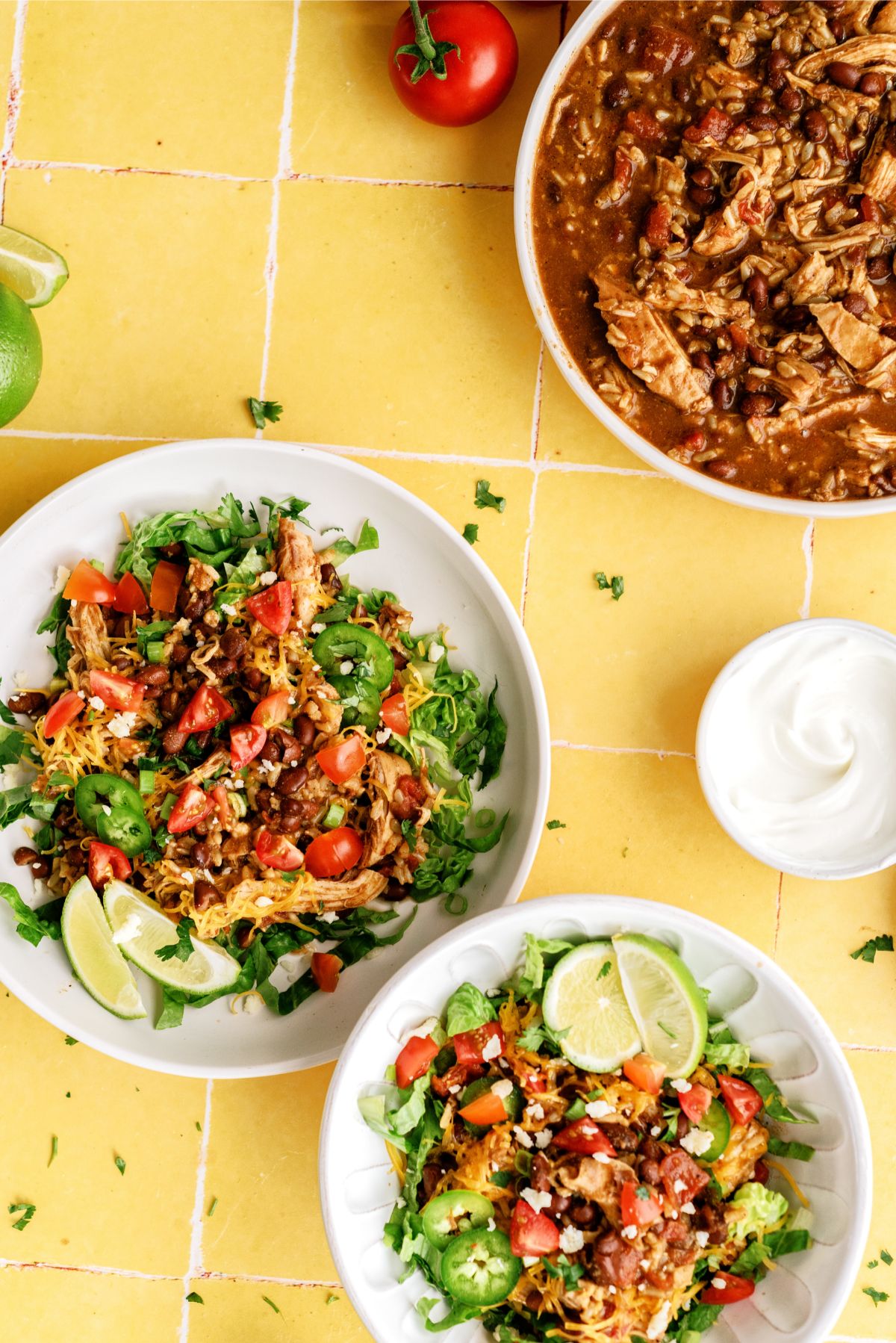 2 Instant Pot Chicken Burrito Bowls with toppings