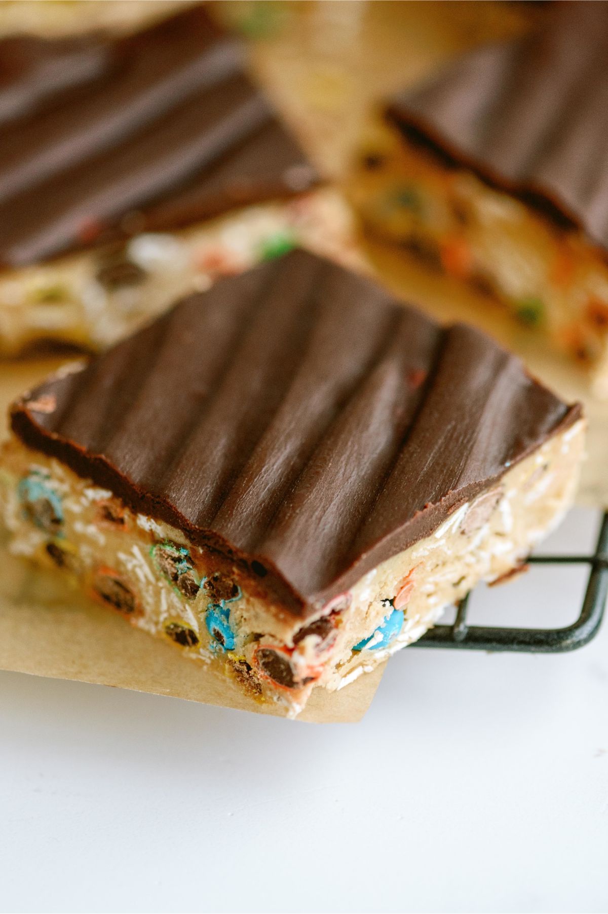 Close up of Monster Cookie No Bake Bars cut into squares