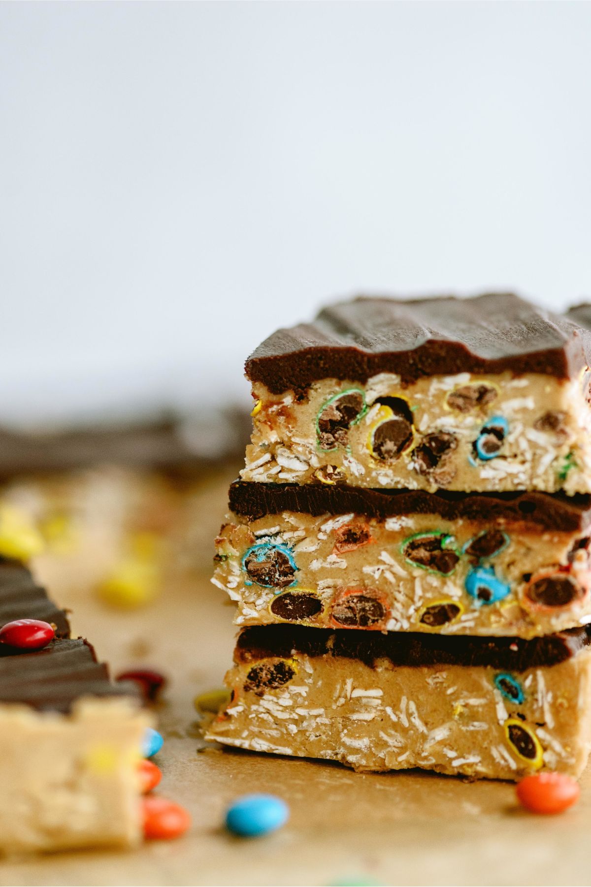 3 squares of Monster Cookie No Bake Bars stacked