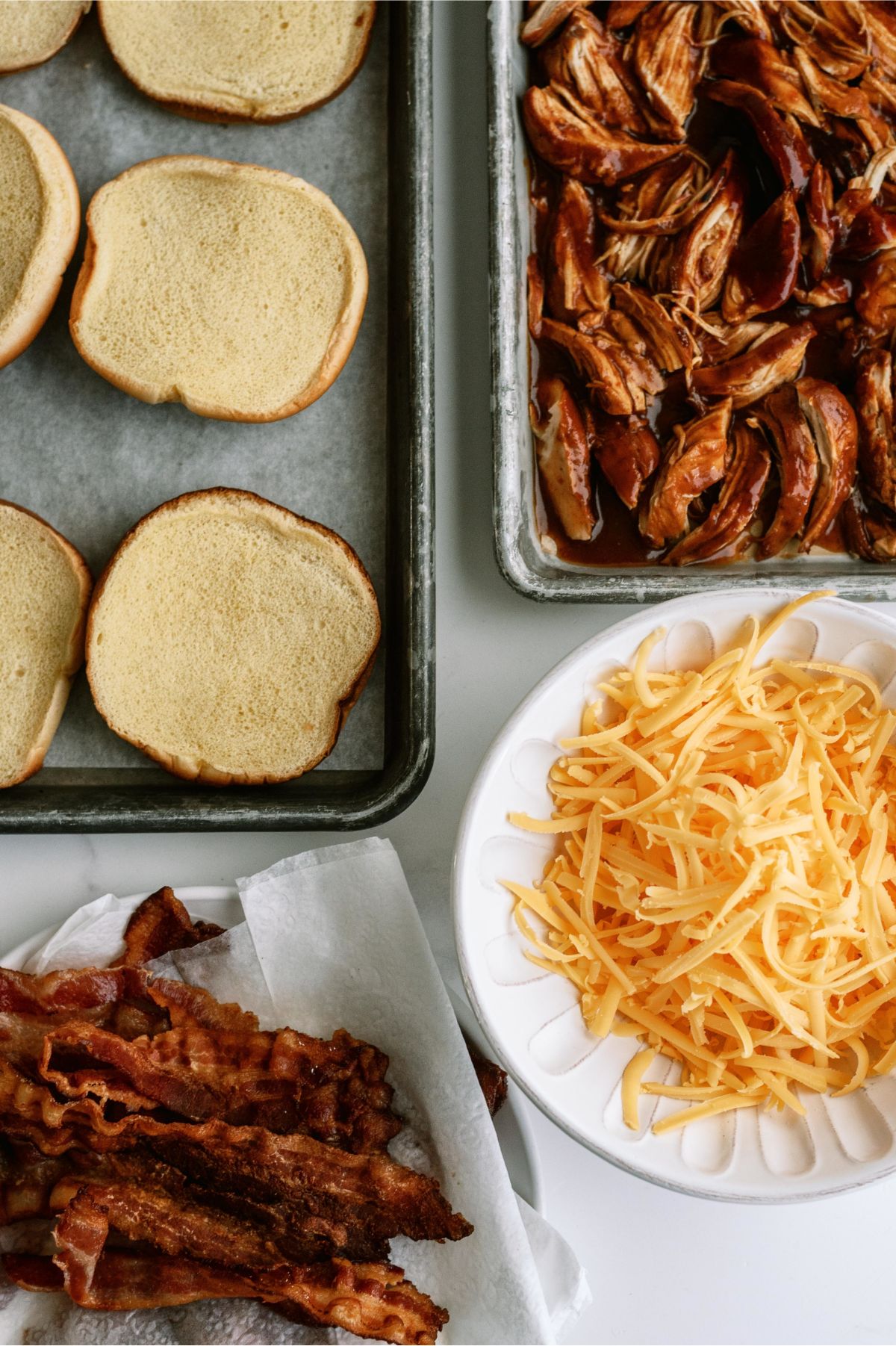 Ingredients needed to make Slow Cooker Cheesy BBQ Chicken Bacon Sandwiches