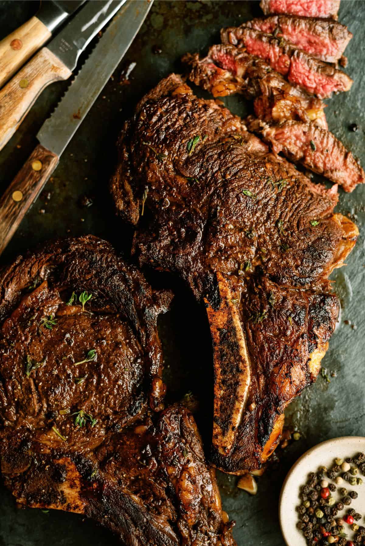 Tangy Marinated Steak sliced on a cutting board