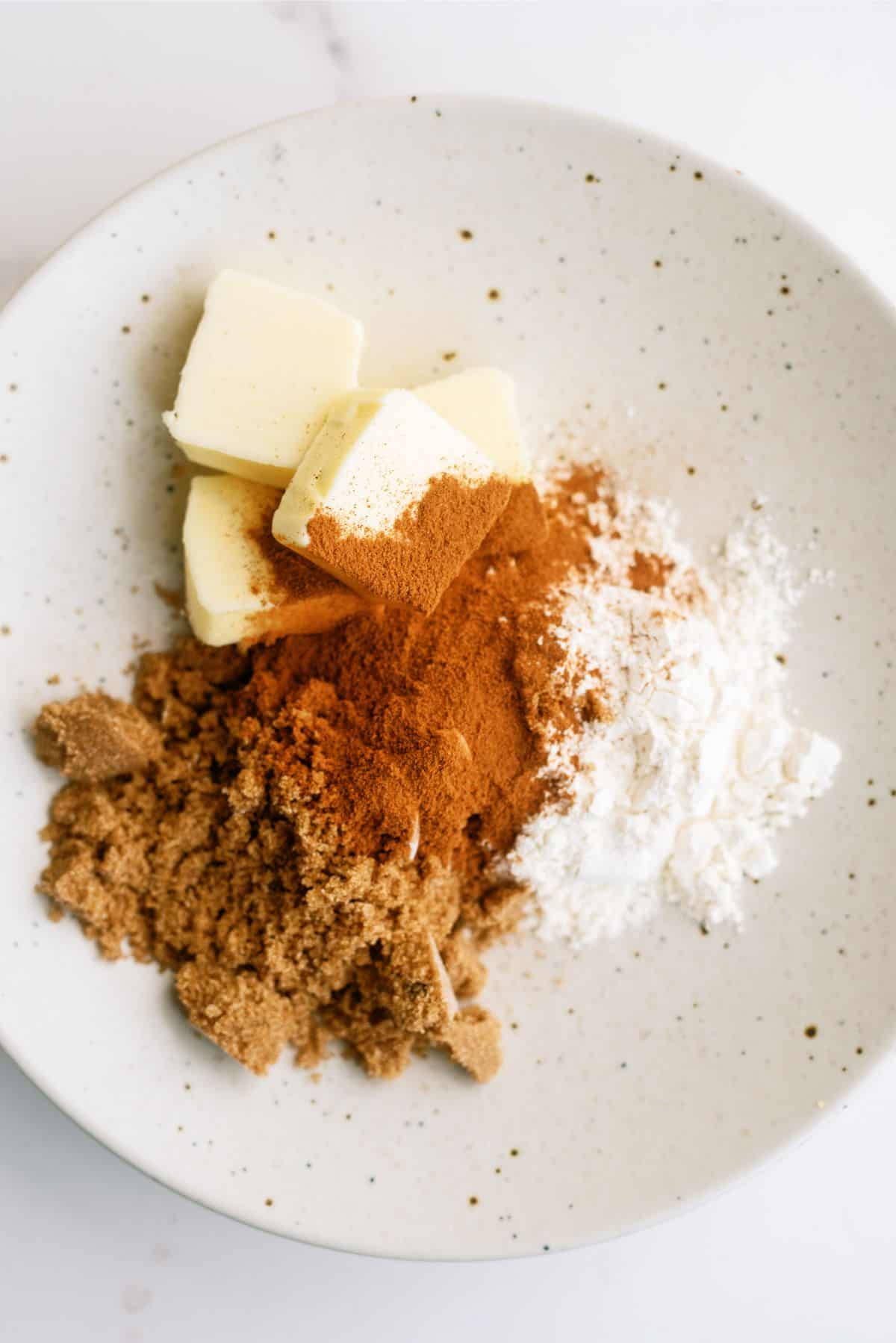 Ingredients for streusel in a shallow bowl.