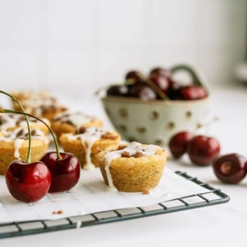 cherry cobbler cookie cups with fresh cherries on the side