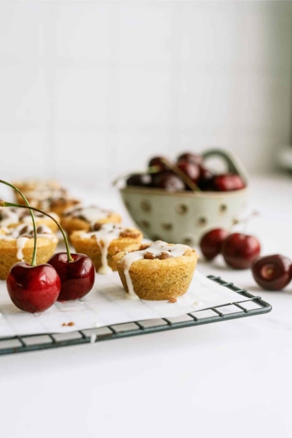 cherry cobbler cookie cups with fresh cherries on the side
