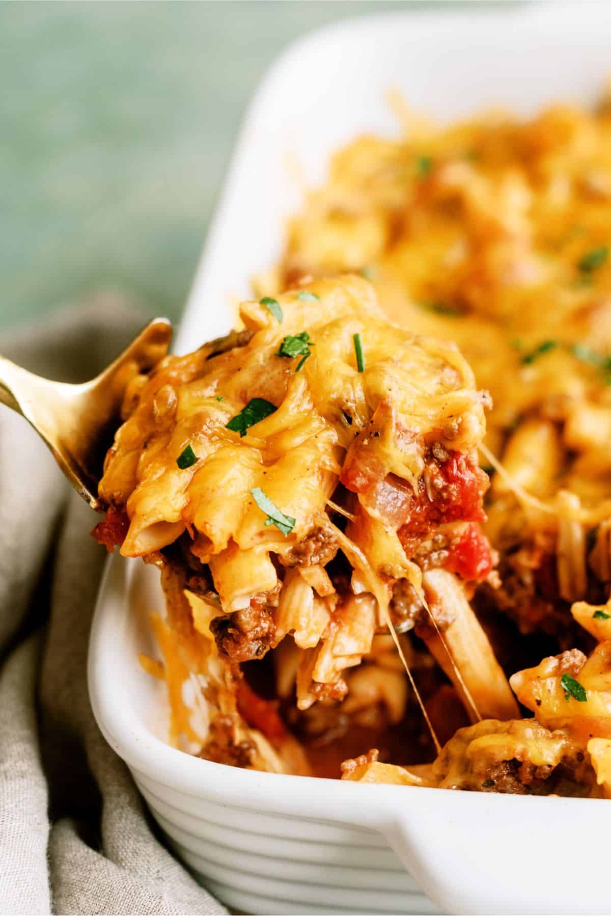 Easy Cheeseburger Casserole with a serving being scooped out