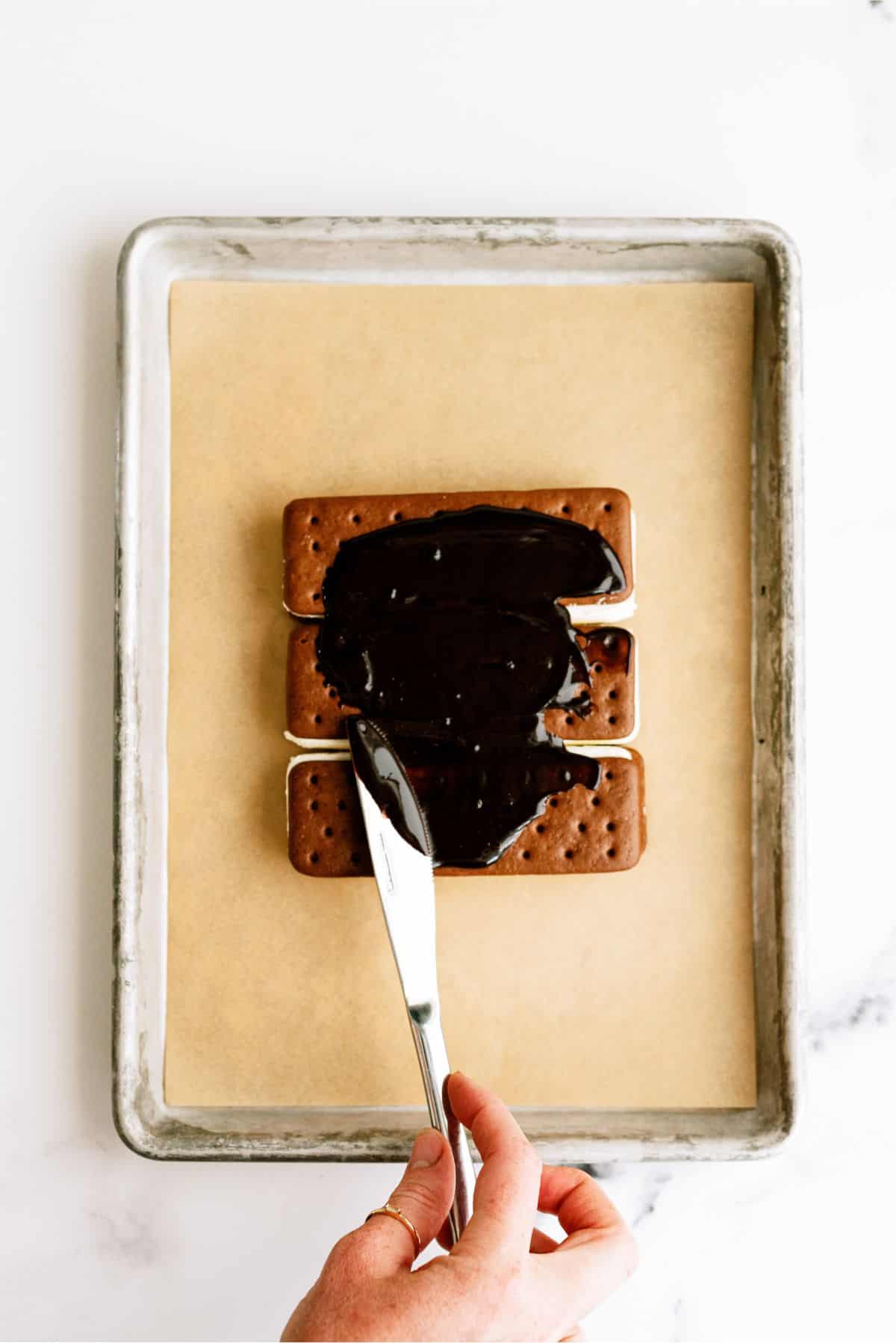 Magic Shell spread on top of ice cream sandwiches