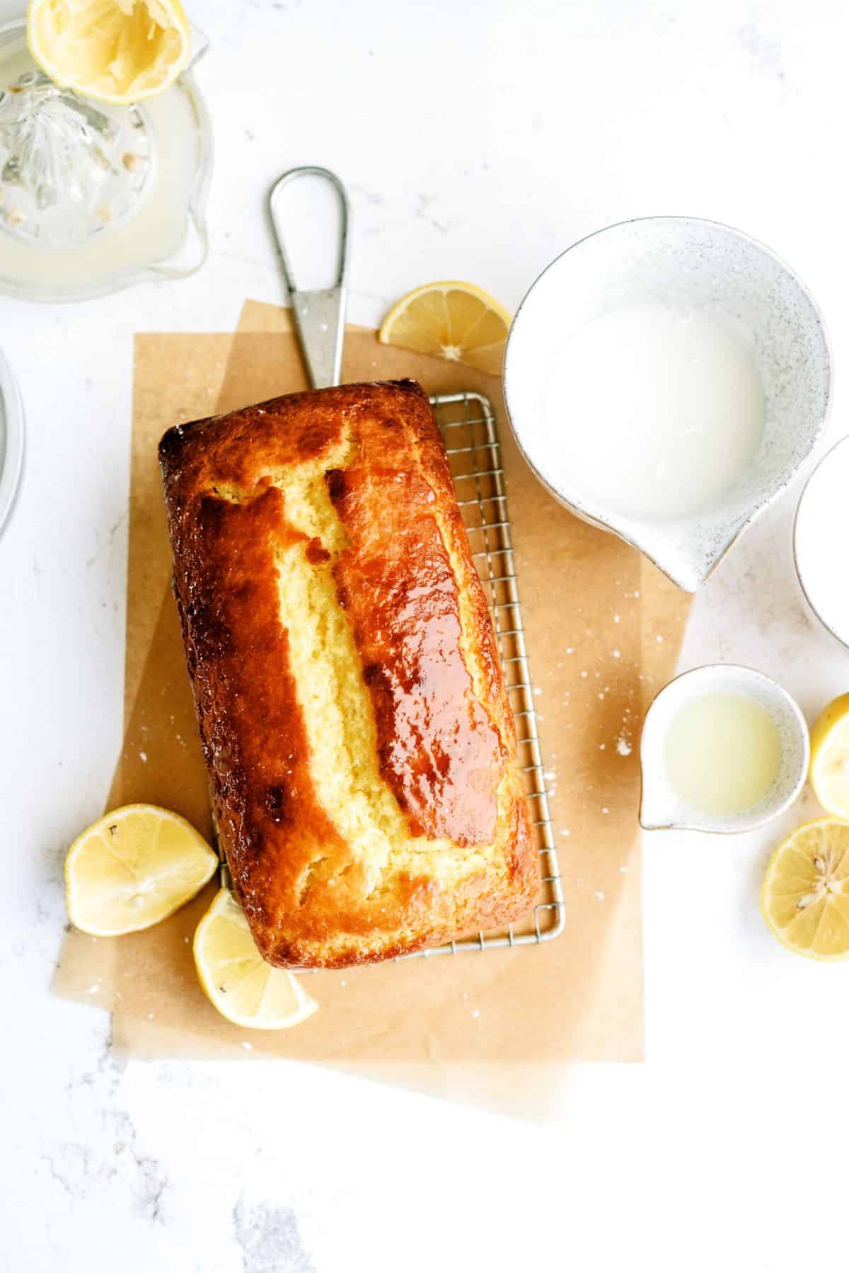 Lemon Yogurt Bread with powdered sugar and lemon juice on the side