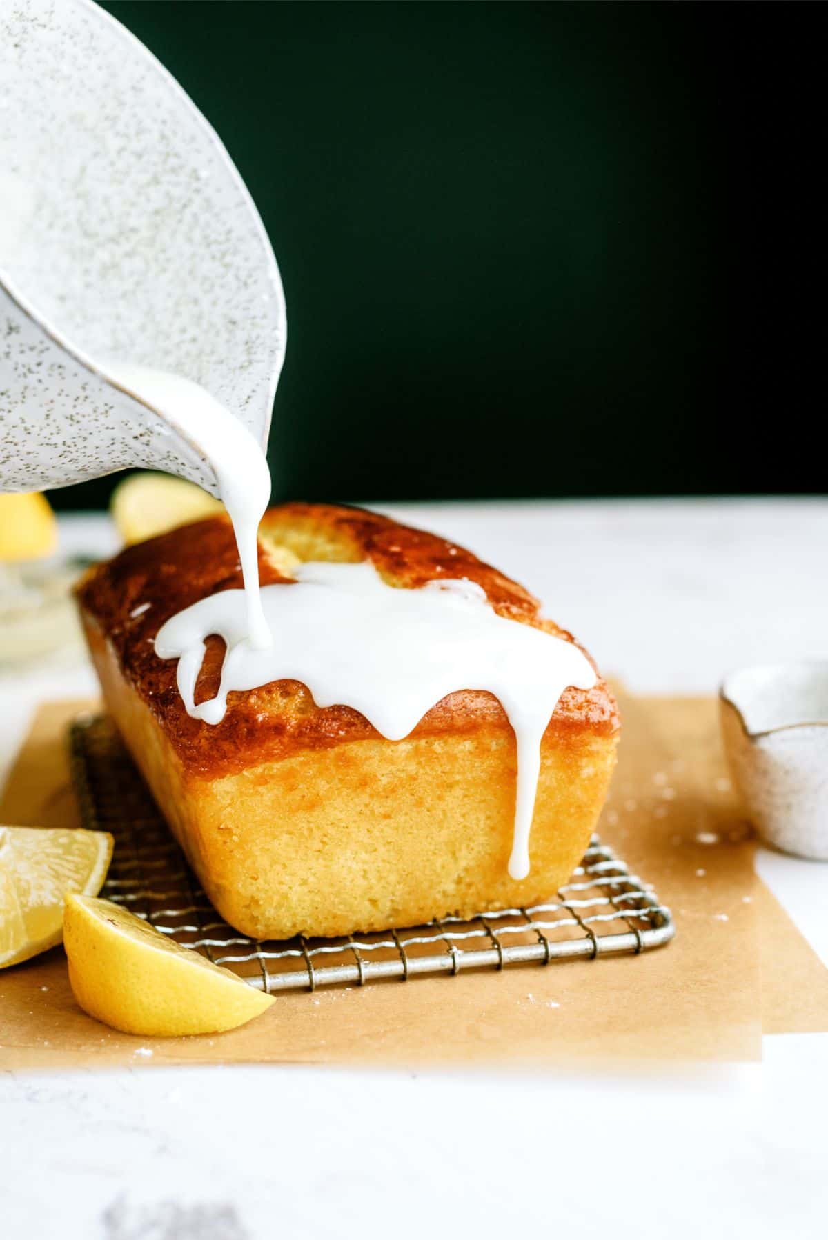 Pouring glaze on top of Lemon Yogurt Bread