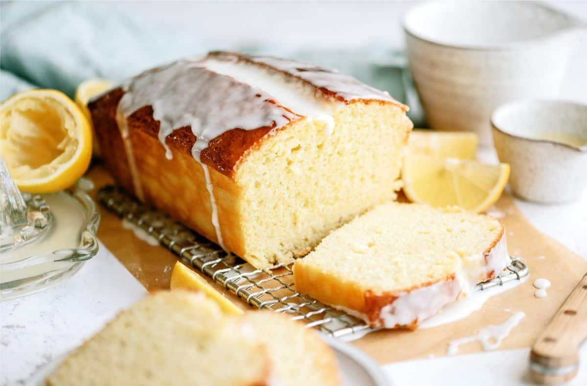 A loaf of Lemon Yogurt Bread with glaze sliced