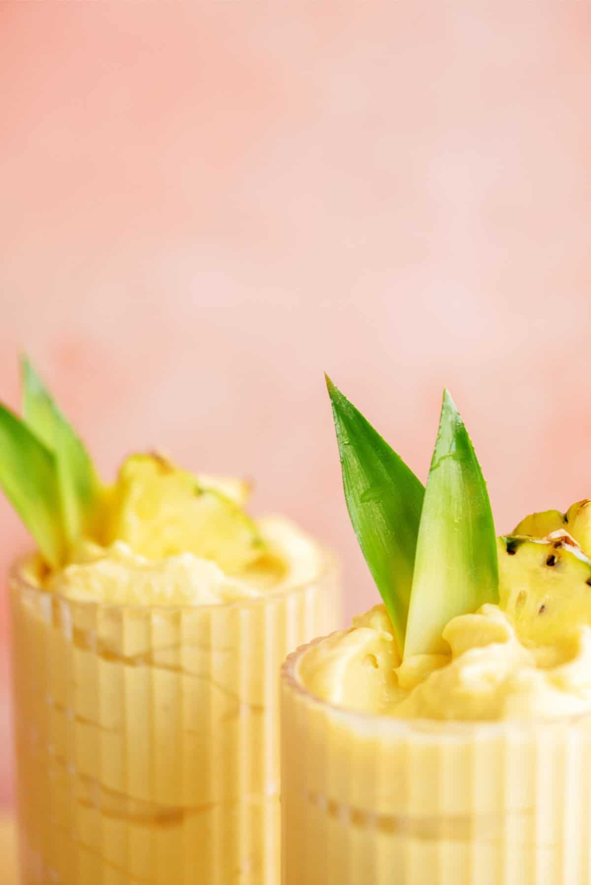 Close up of 2 glasses of Mango and Pineapple Dole Whip