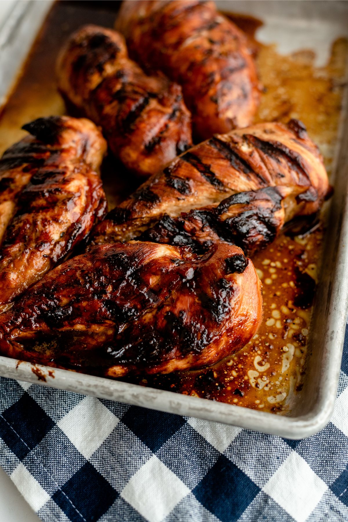 A pan full of Marinated Root Beer Grilled Chicken