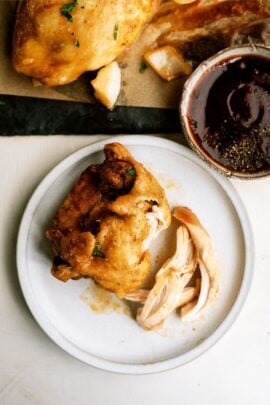 slow cooker bbq chicken thighs on a plate