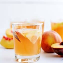 A glass of Sparkling Peach Punch Drink