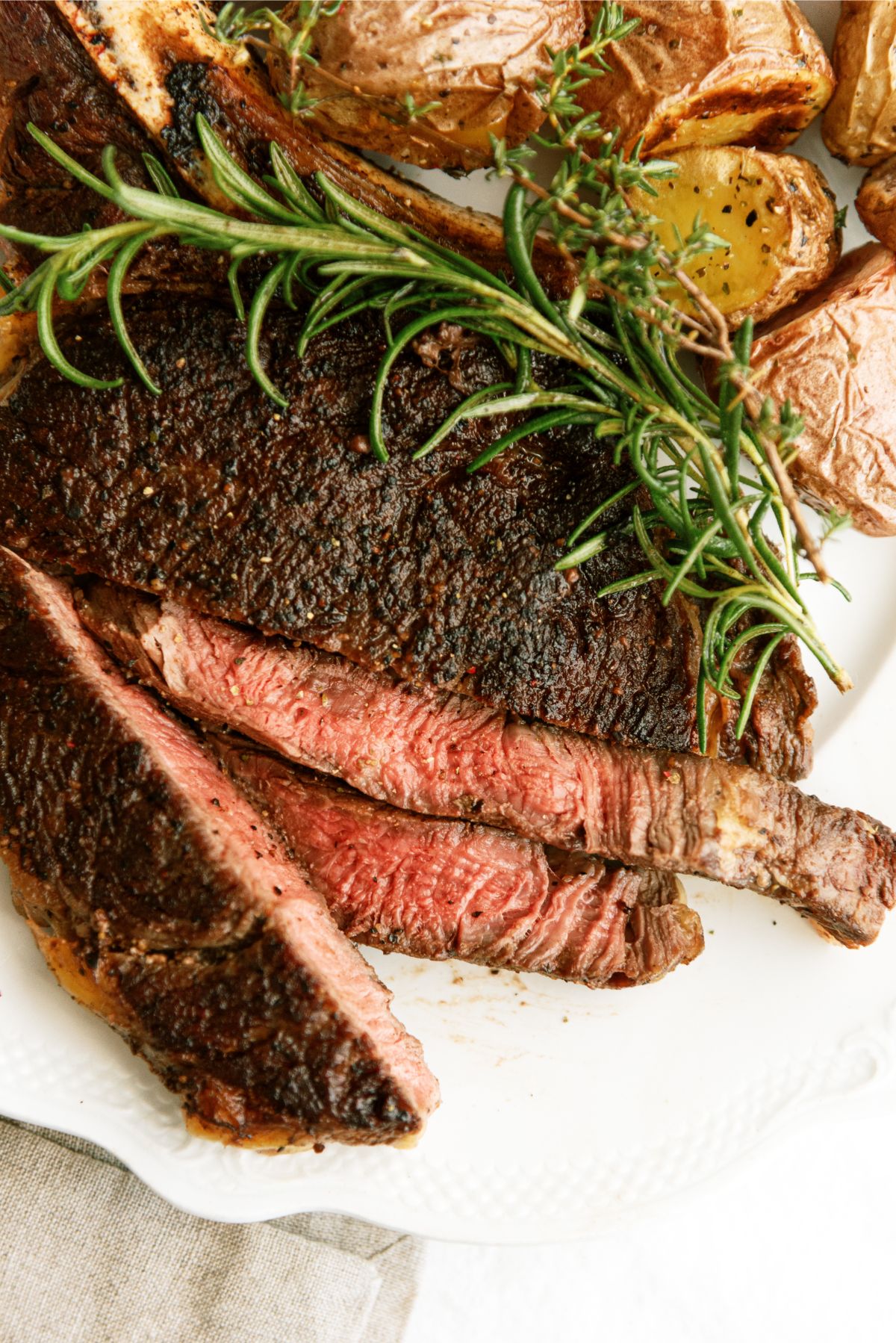 Close up of New York Bone In Steak sliced in strips