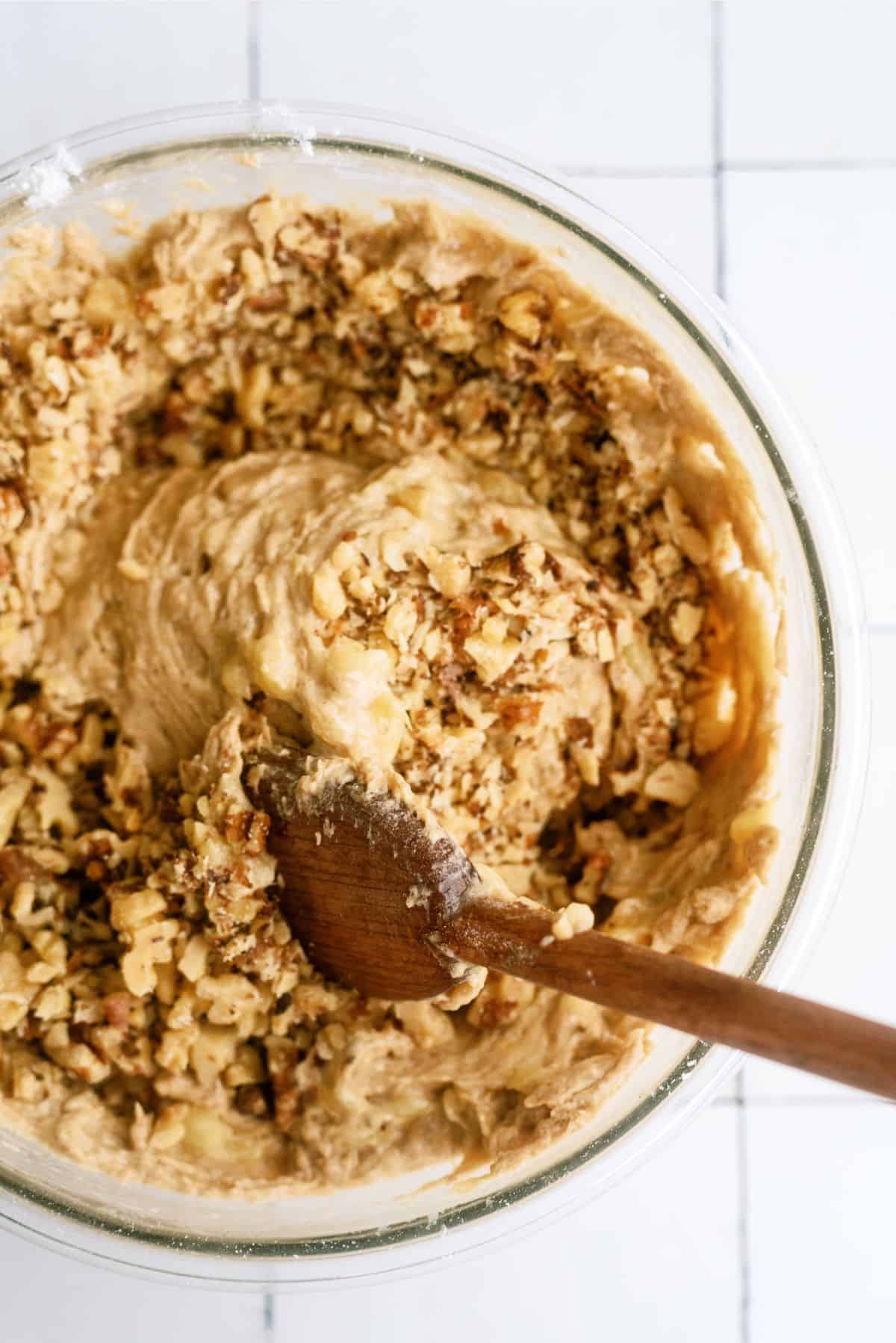 Folding walnuts into banana bread batter