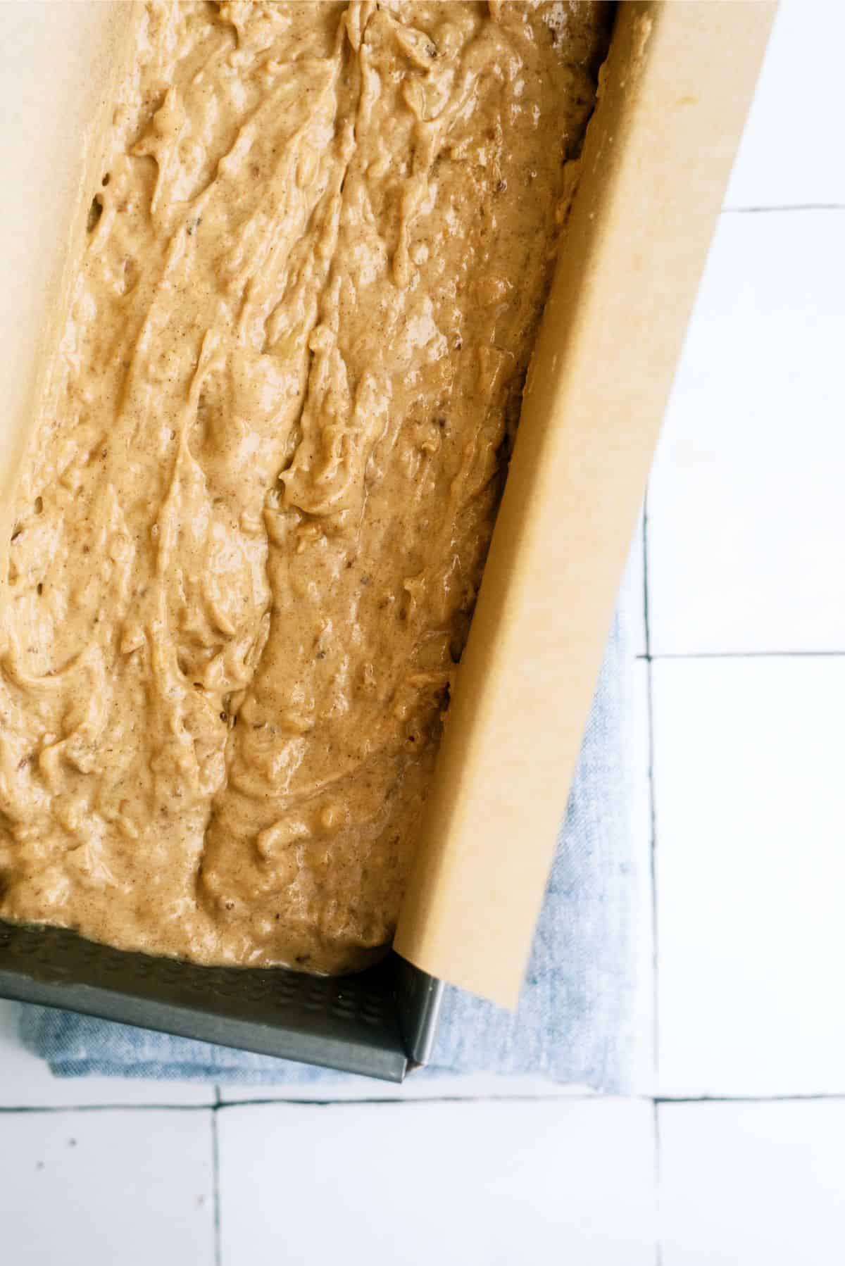 Banana Bread Batter in loaf pan ready to bake.