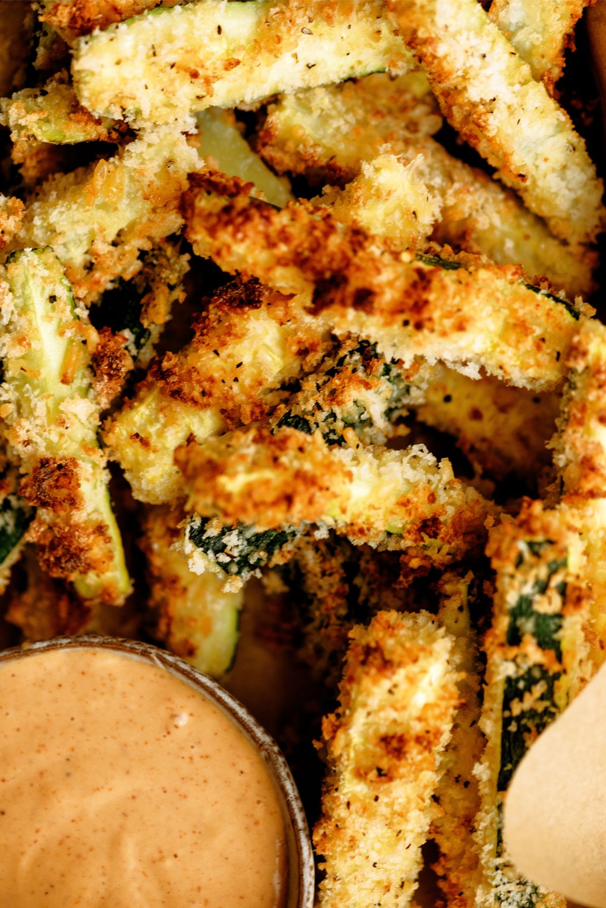 Close up top view of Crispy Zucchini Fries and Creamy BBQ Sauce