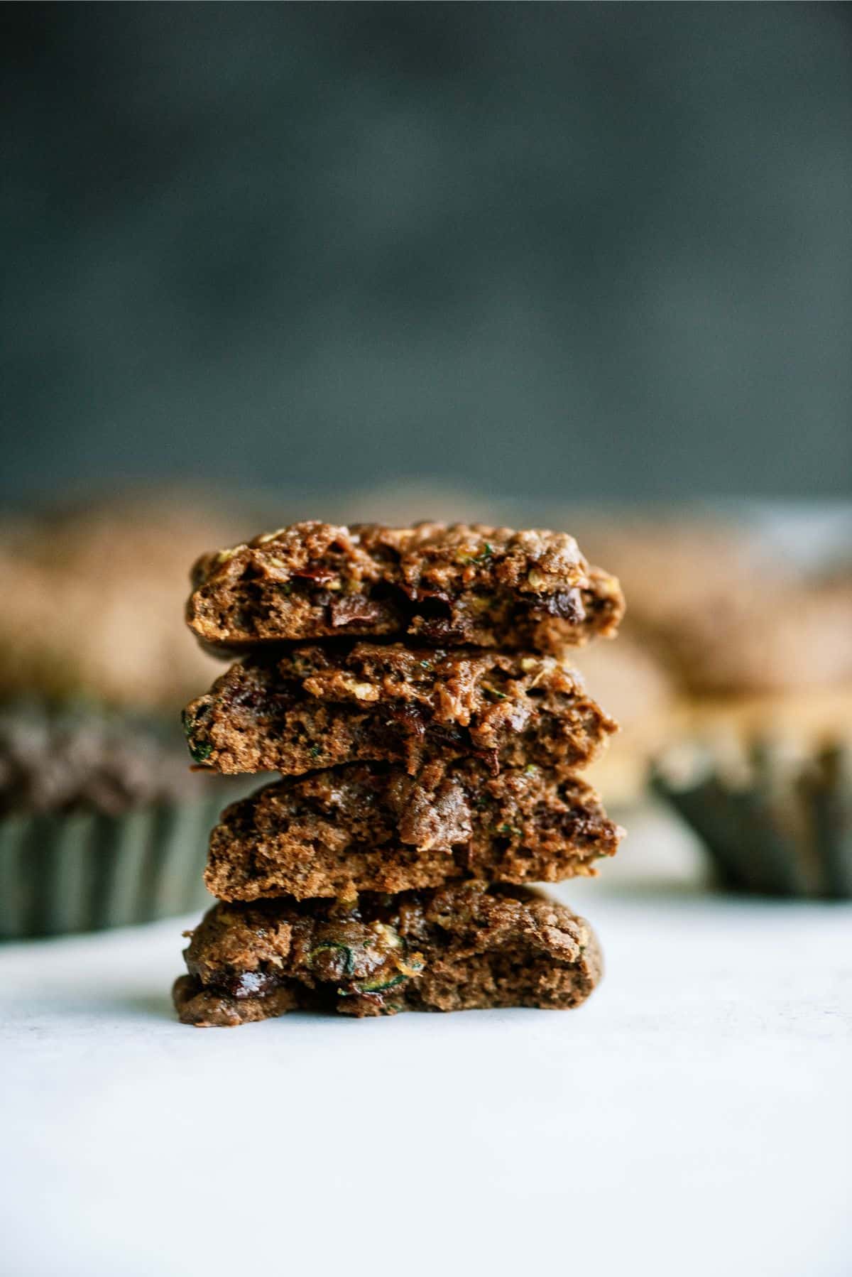 Double Chocolate Zucchini Cookies stacked and broken in half.
