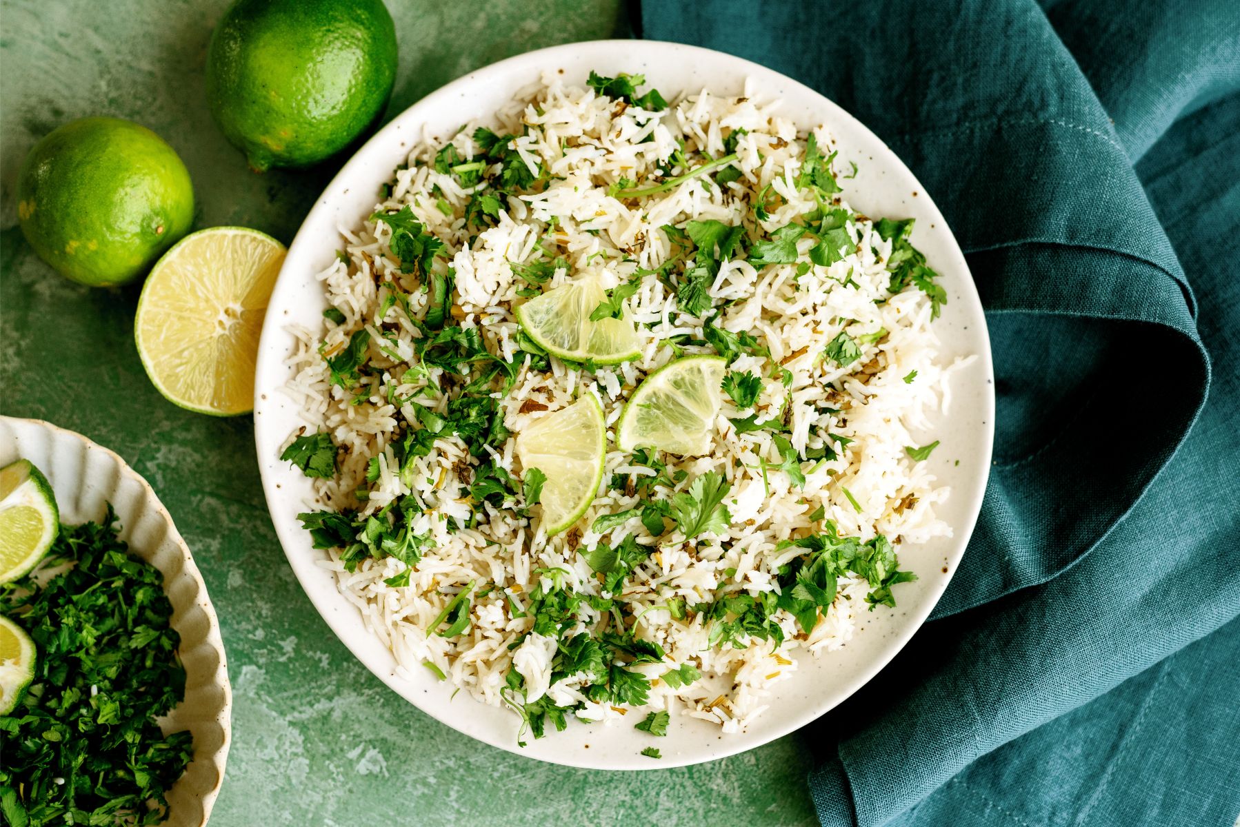 Top view of a plate of Instant Pot Cilantro Lime Rice with limes