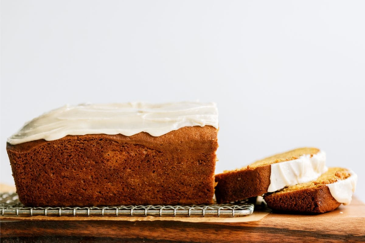 Pumpkin Bread with Maple Glaze sliced on cutting board