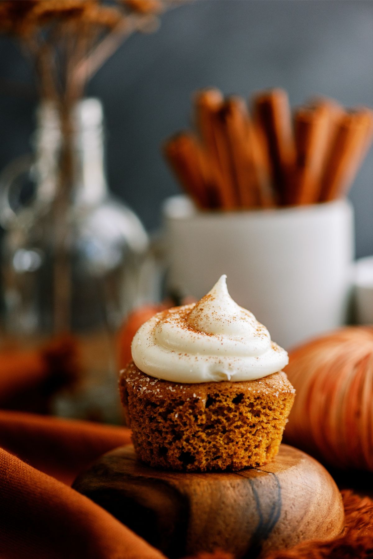Pumpkin Cupcakes topped with cream cheese frosting