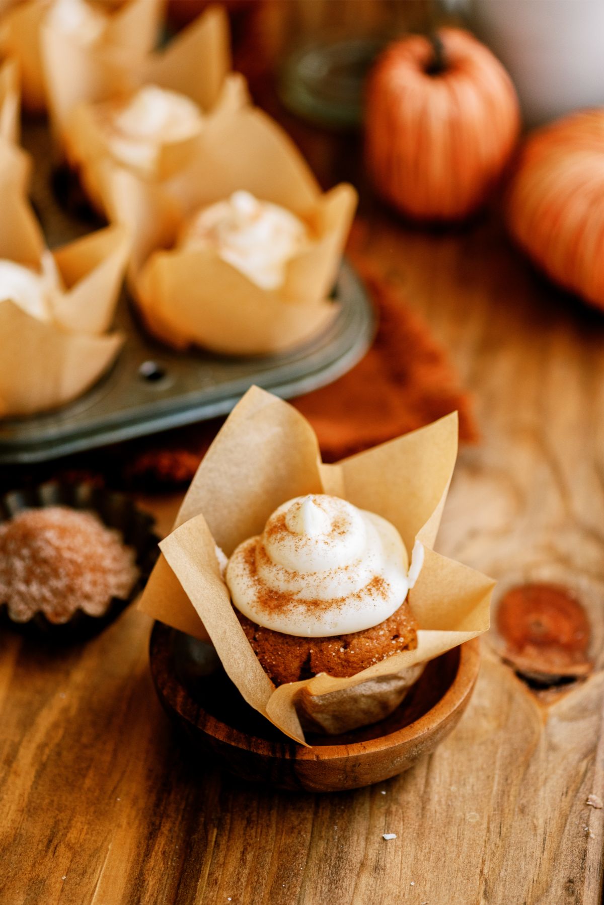 Pumpkin Cupcakes in liners with some in a muffin tin