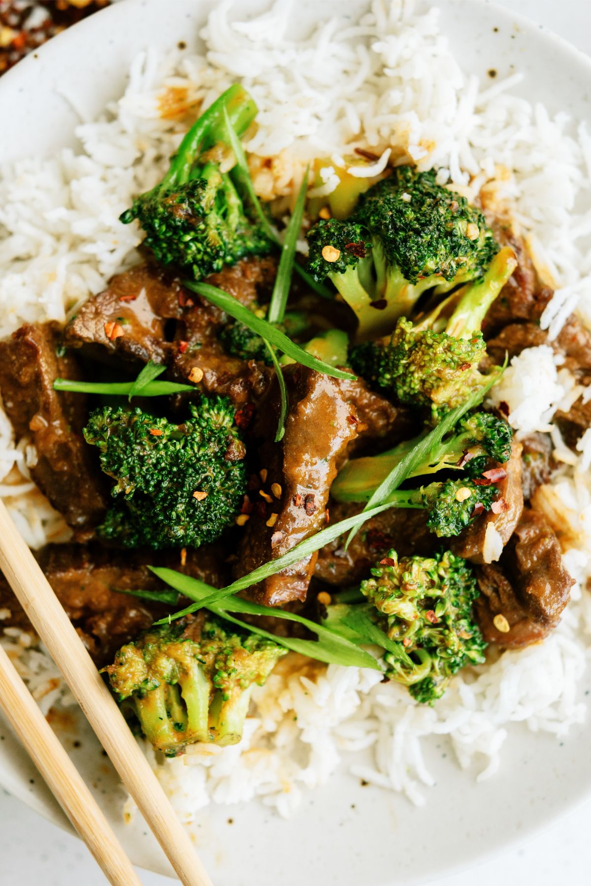 Close up of a plate of Beef and Broccoli served over white rice