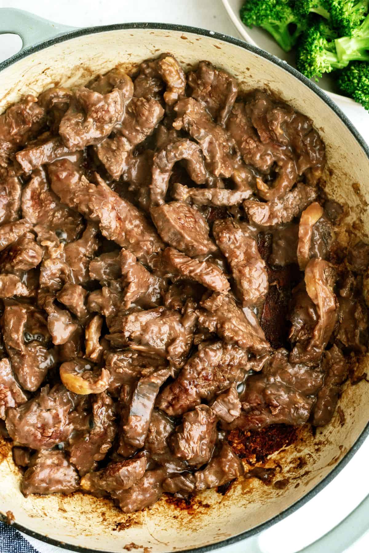 Browning steak pieces in skillet