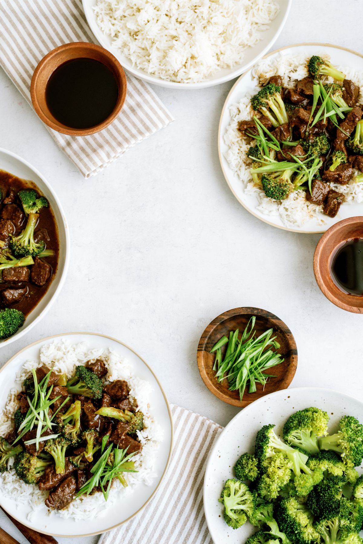 Plates of Instant Pot Beef and Broccoli, Rice, broccoli and soy sauce