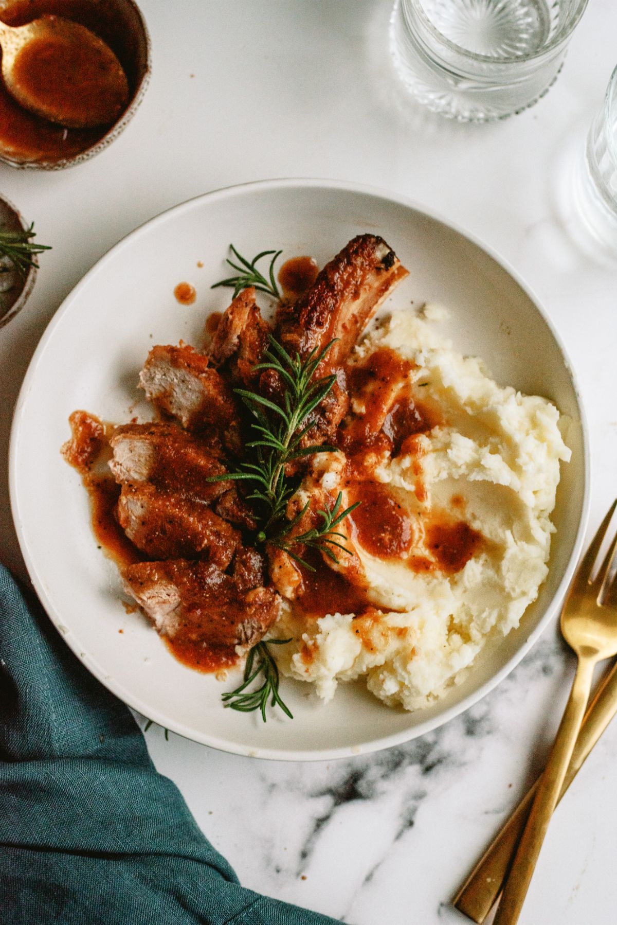 Instant Pot Cranberry Pork Chops sliced and served with mashed potatoes