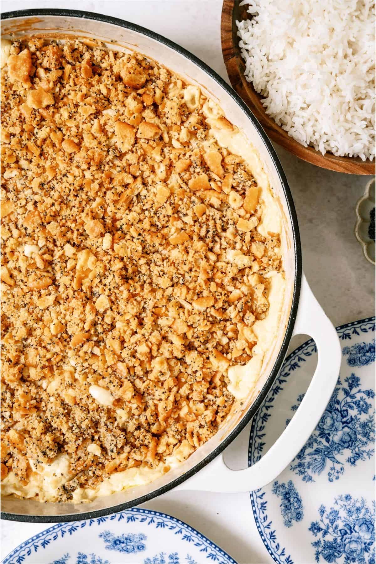 Poppy Seed Chicken Casserole with a bowl of rice on the side.