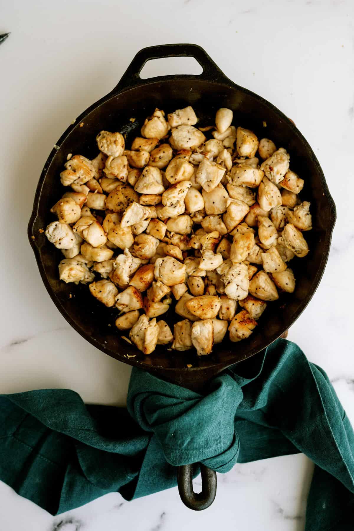 Browned chicken in a skillet