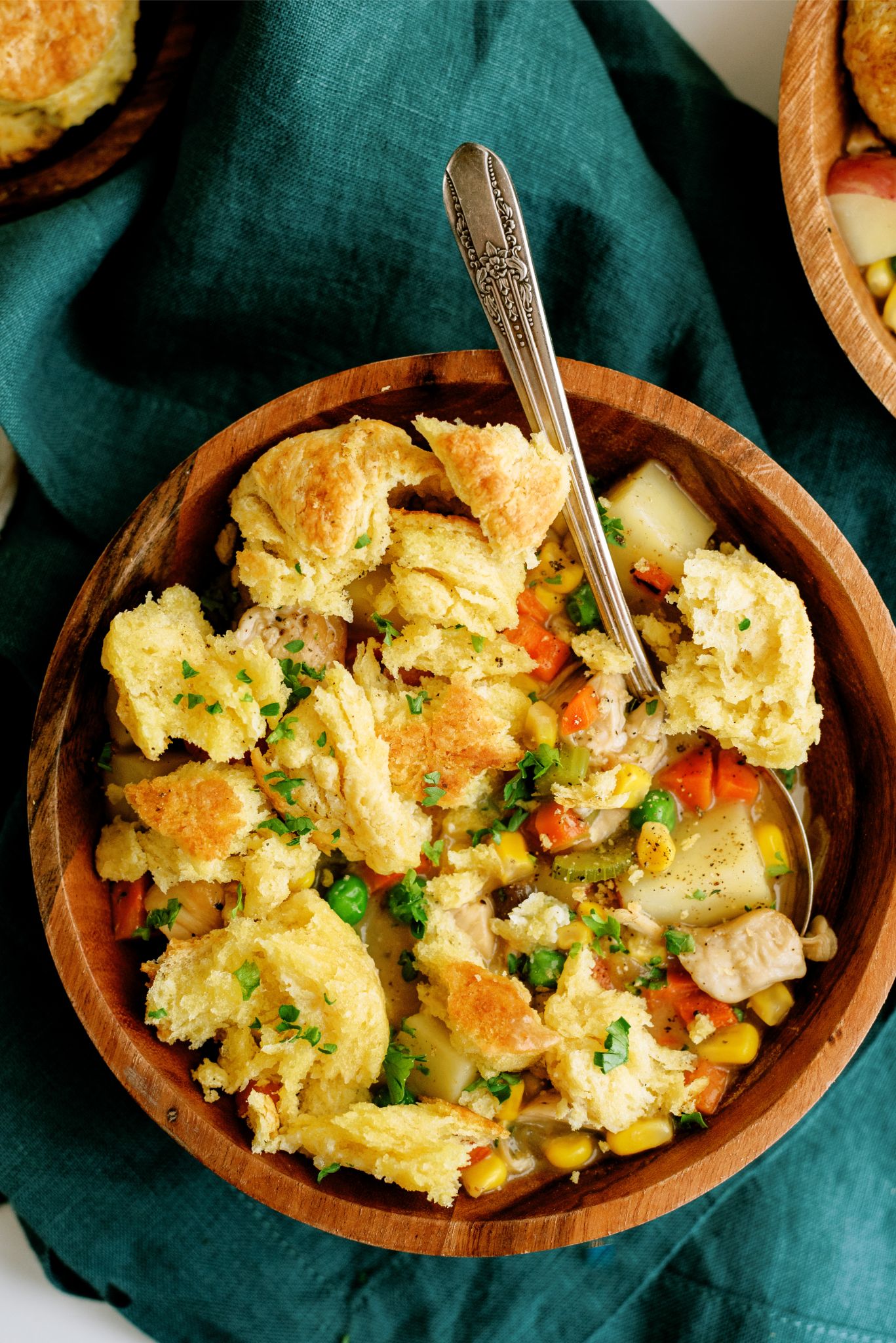 A bowl of Slow Cooker Chicken Pot Pie with biscuit pieces mixed in.