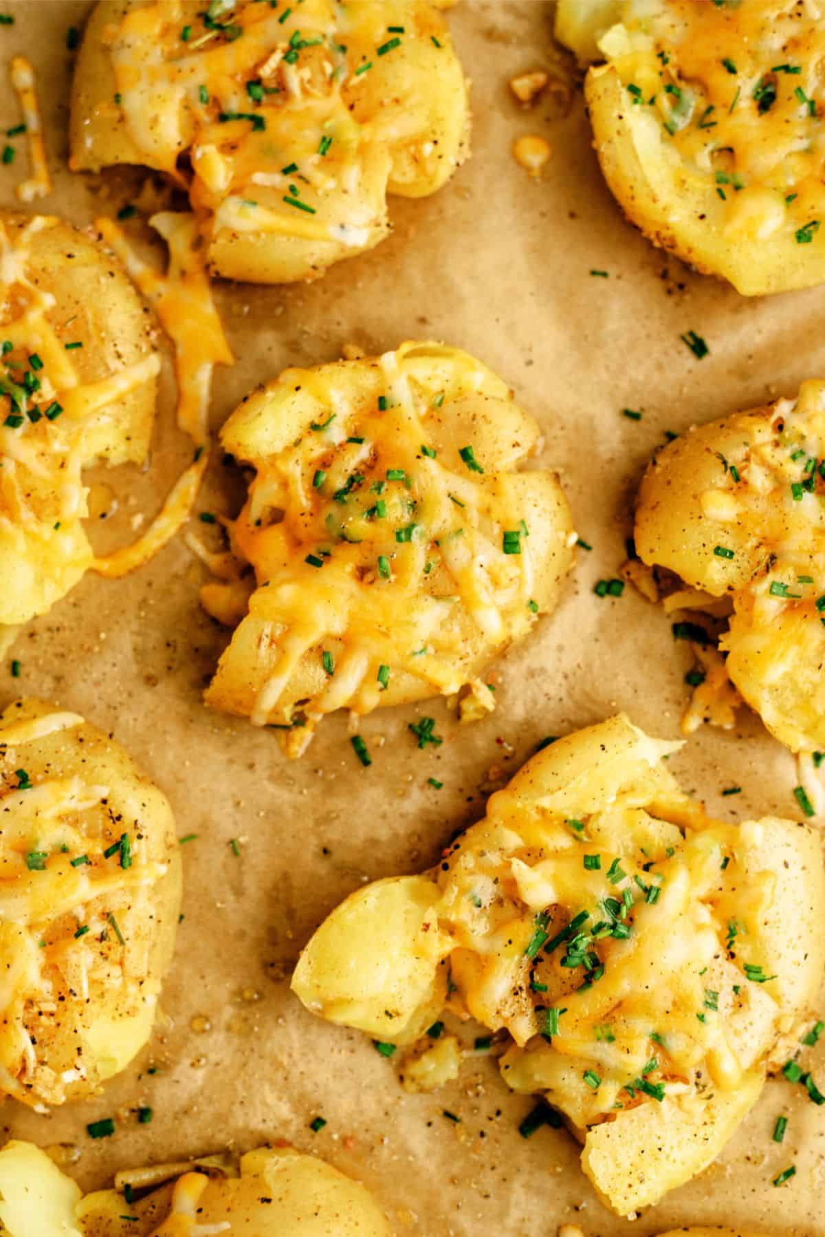 Smashed Cheesy Potatoes on a baking sheet