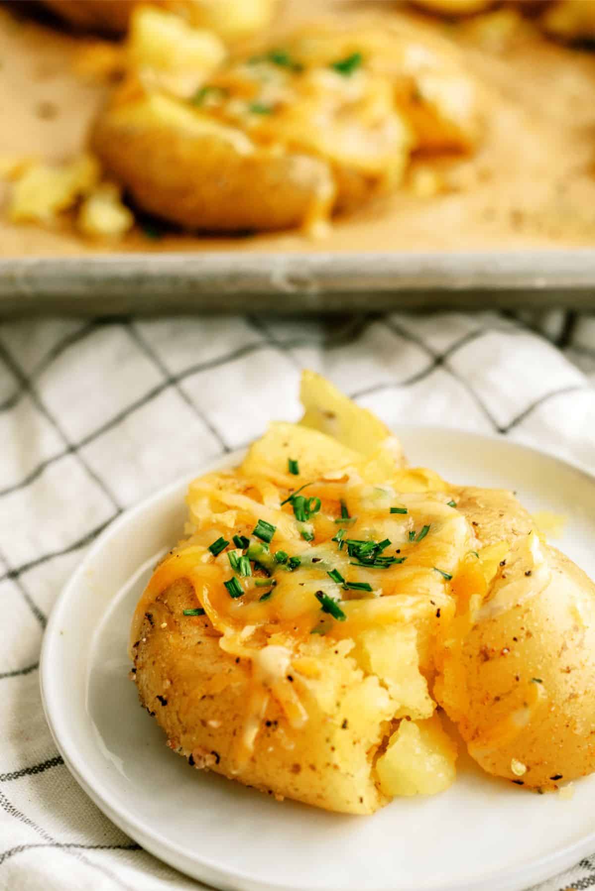 Smashed Cheesy Potato on a serving plate