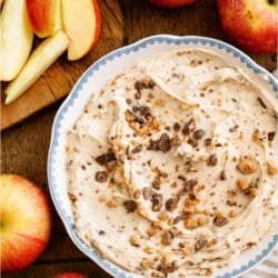 Toffee Apple Dip in a bowl surrounded by fresh apples.