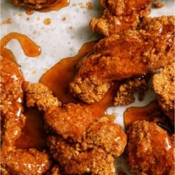 Top view of Winger’s Copycat Sticky Fingers on a sheet pan, with sauce on top.