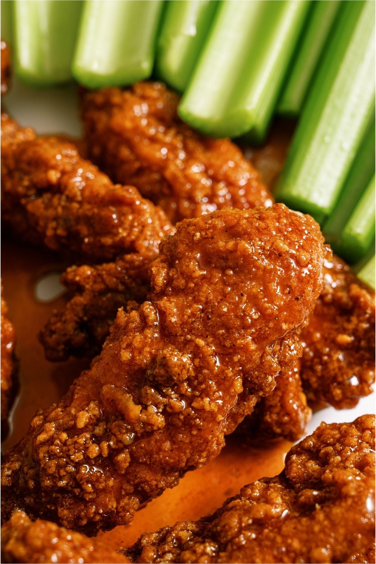 Close up of Winger’s Copycat Sticky Fingers with celery sticks.