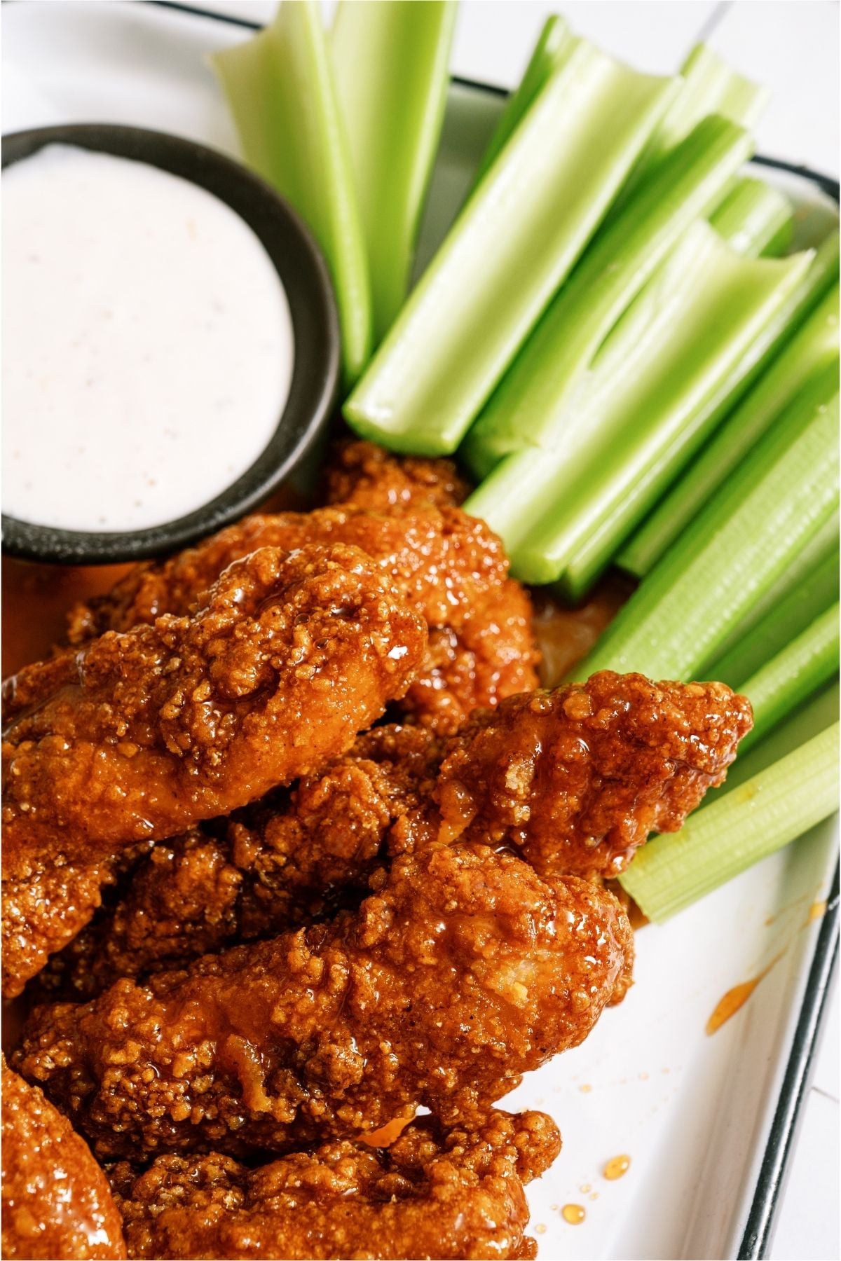 Winger’s Copycat Sticky Fingers with celery sticks and a side of ranch.