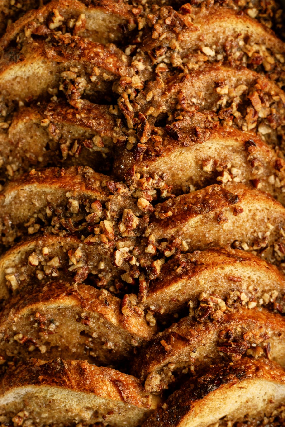 Close up of Overnight Praline Pecan French Toast Bake in pan