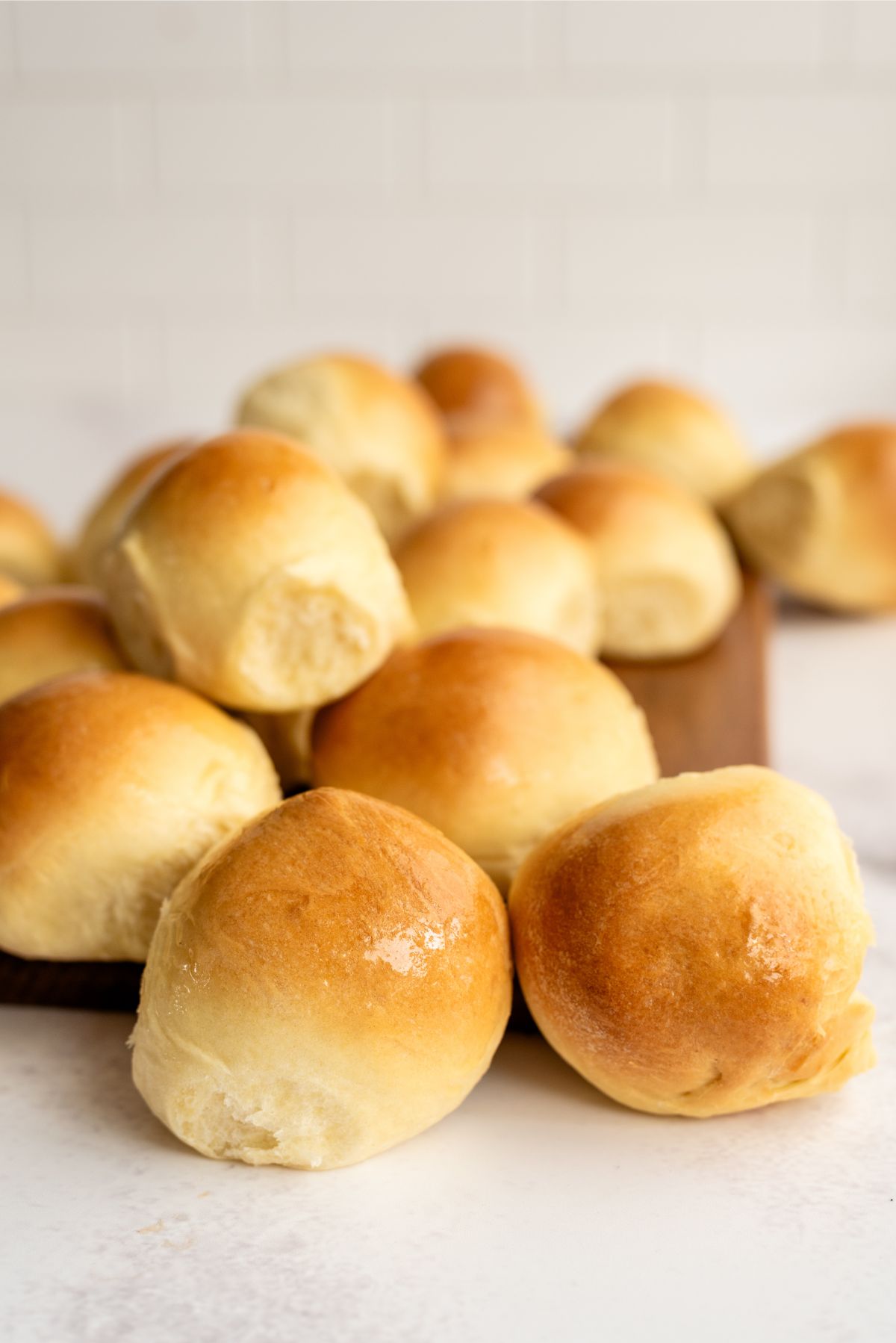 Parkerhouse Rolls freshly baked on a cutting board