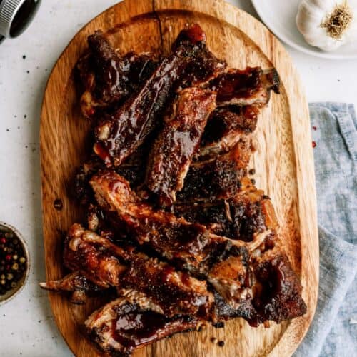 Top view of separated St. Louis Slow Cooker Ribs on a cutting board.