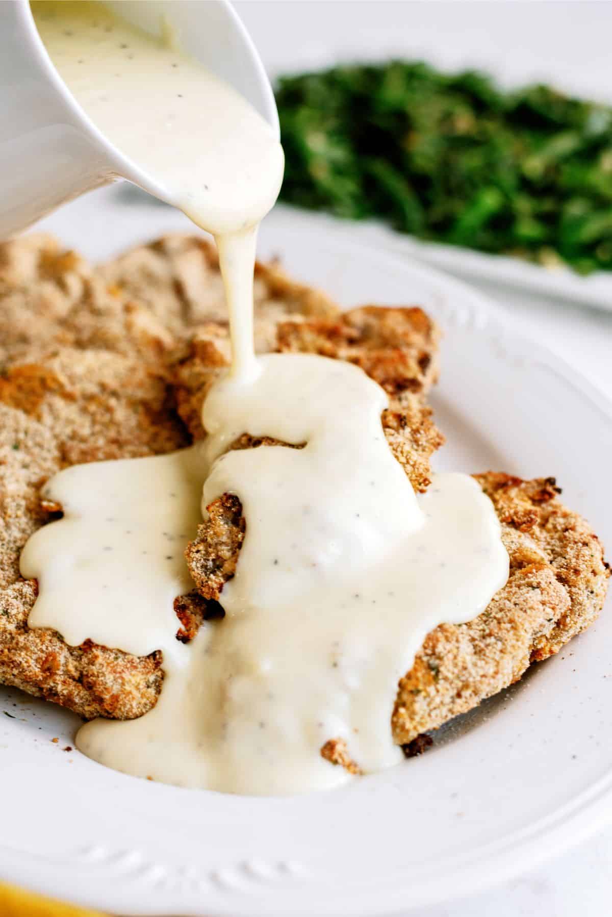 Air Fryer Cube Steak with Gravy being poured on top