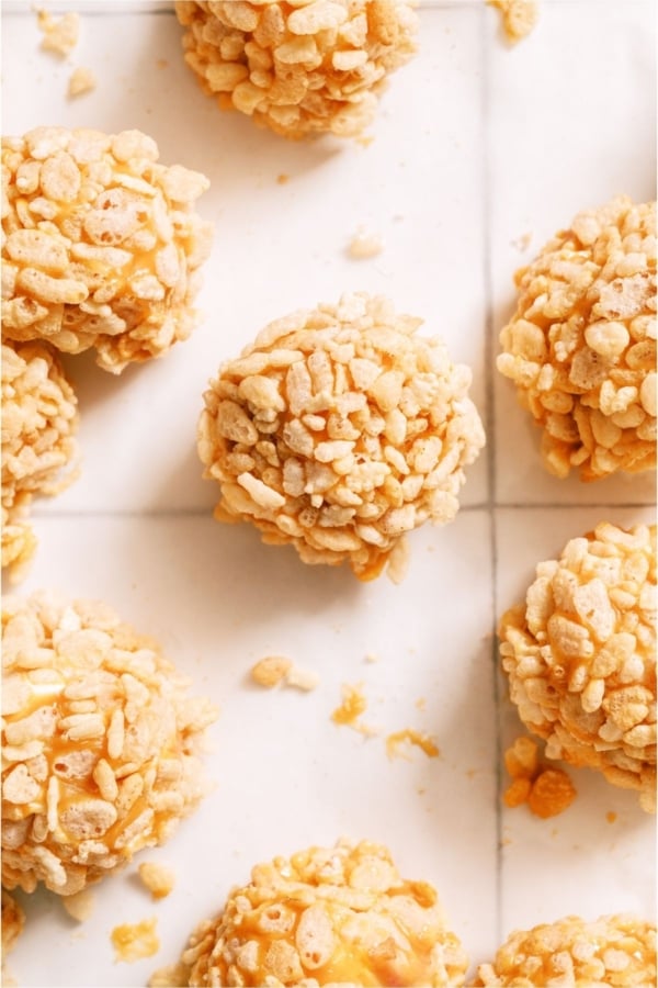 Top view of several Caramel Marshmallow Rice Krispie Balls on a white background.