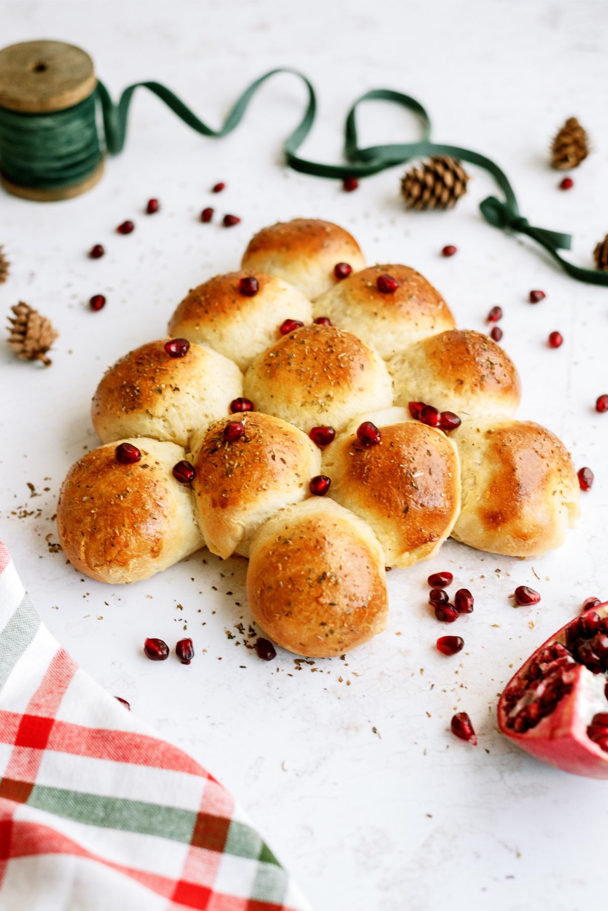 Baked Christmas Tree Dinner Rolls topped with Pomegranate seeds