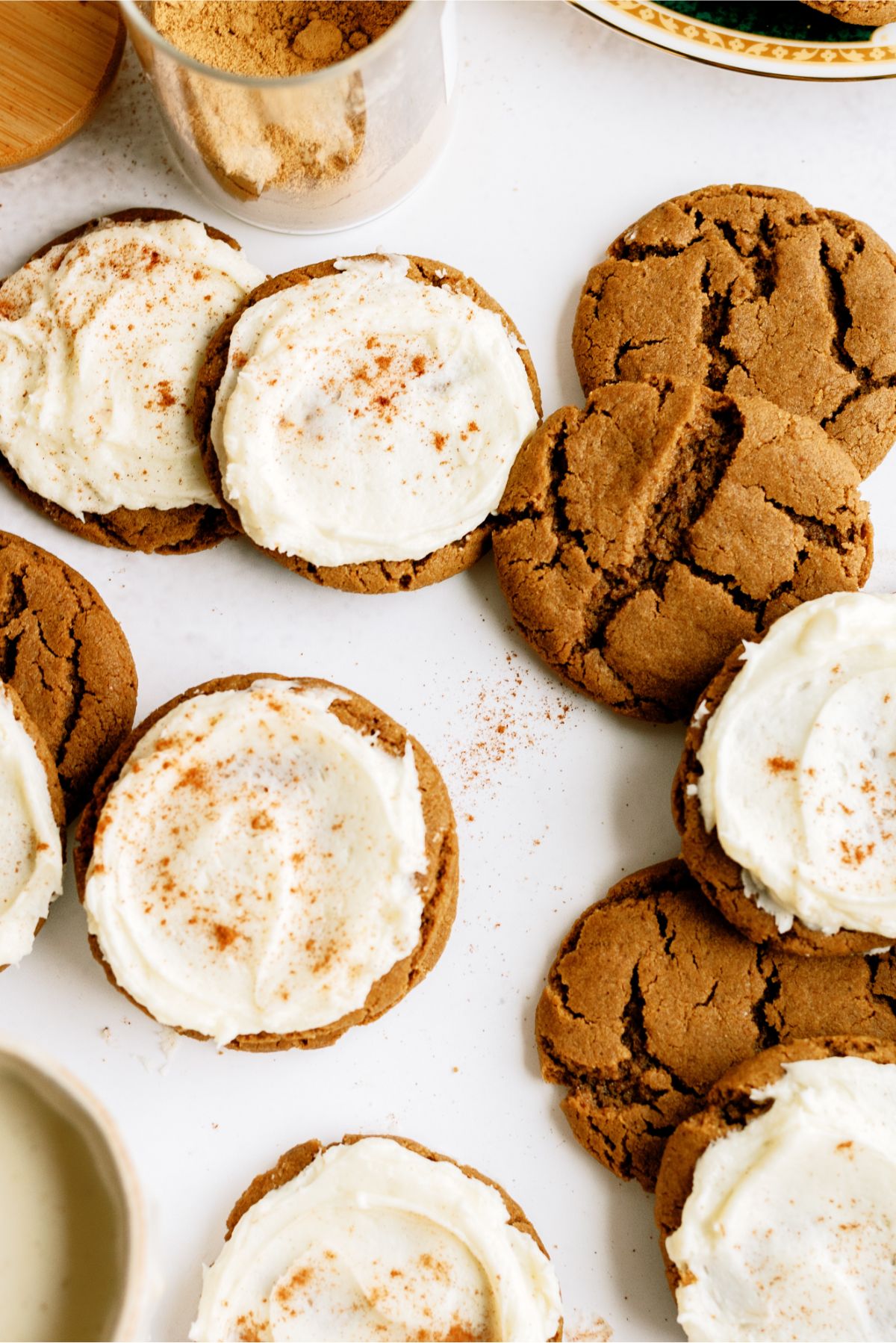 Ginger Cookies with Eggnog Frosting on a counter and some Ginger Cookies without frosting